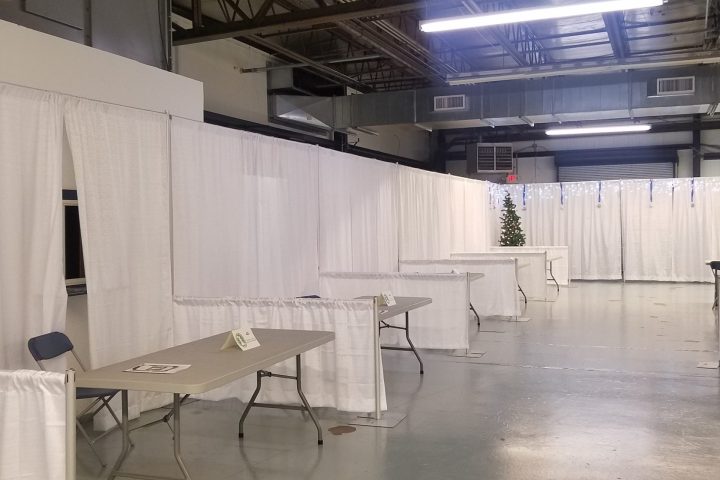 a group of people standing in front of a building