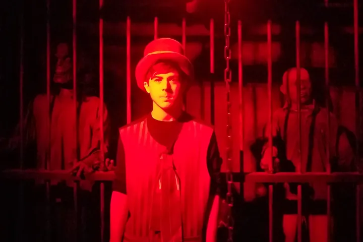 a man that is lit up at night